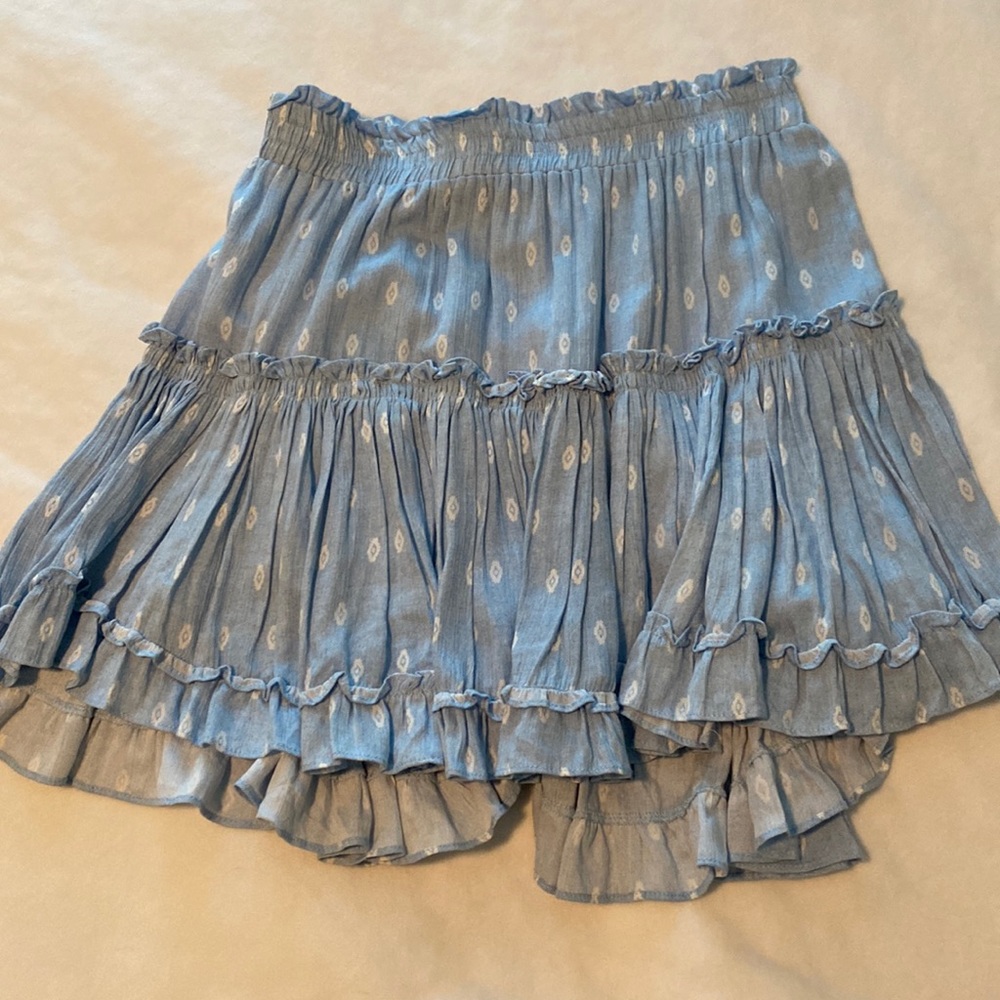 Light blue MISA skirt. High-low and design detail